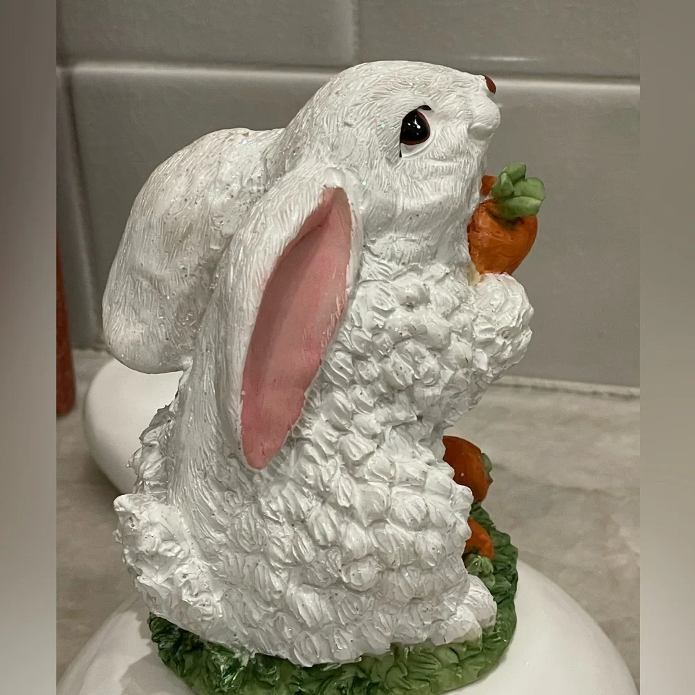 Cute rabbit with carrots statute - rabbit sparkles in light (see video)